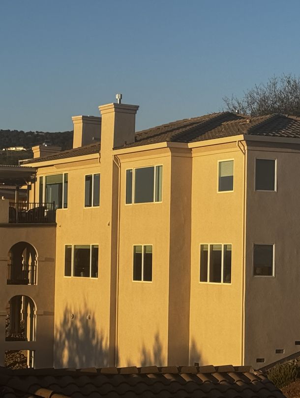 Man on roof conducting repairs